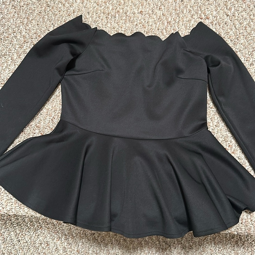 Black peplum top.